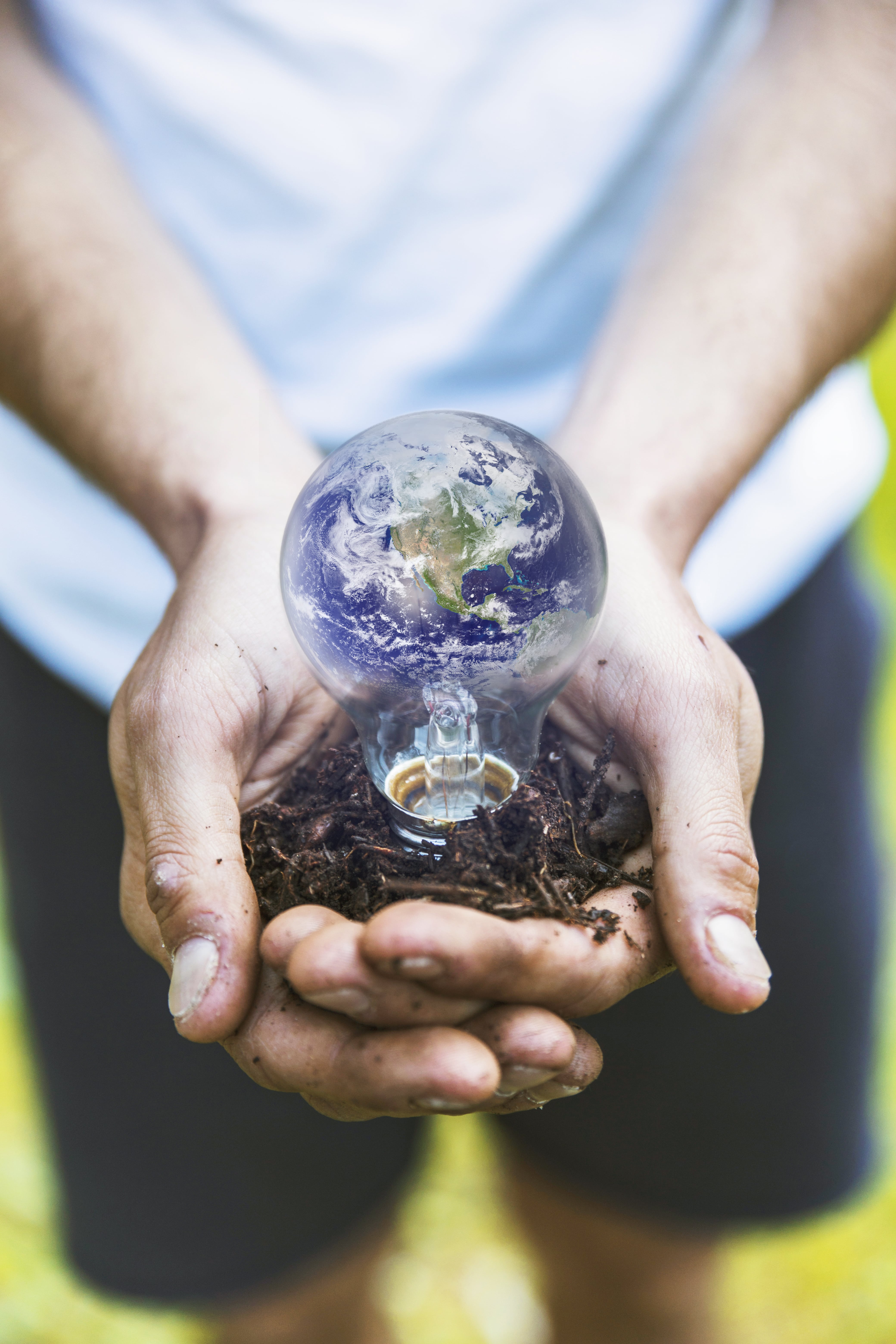 concept-hands-holding-earth-bulb-min